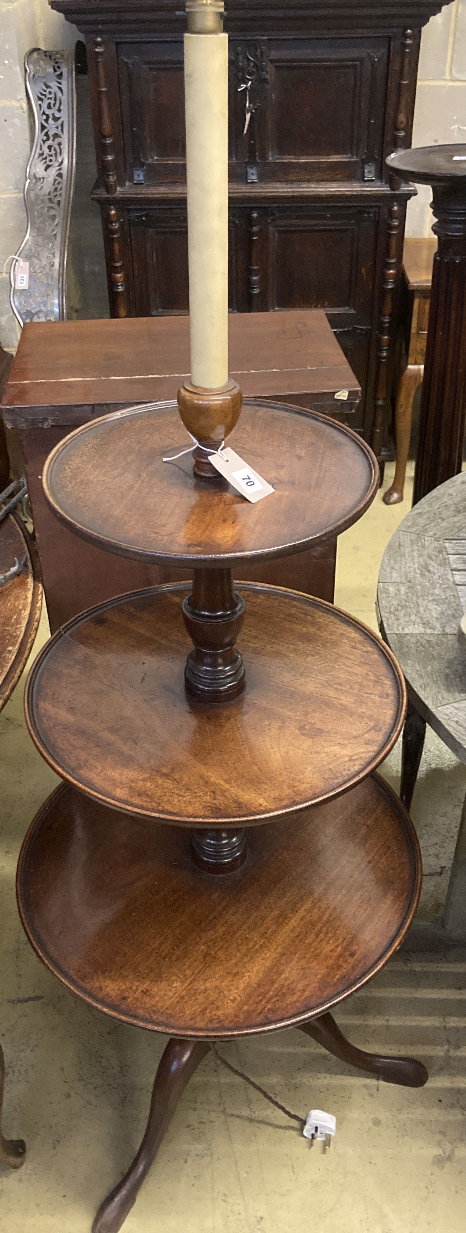 A George III mahogany three tier dumb waiter, converted to a lamp, height 115cm